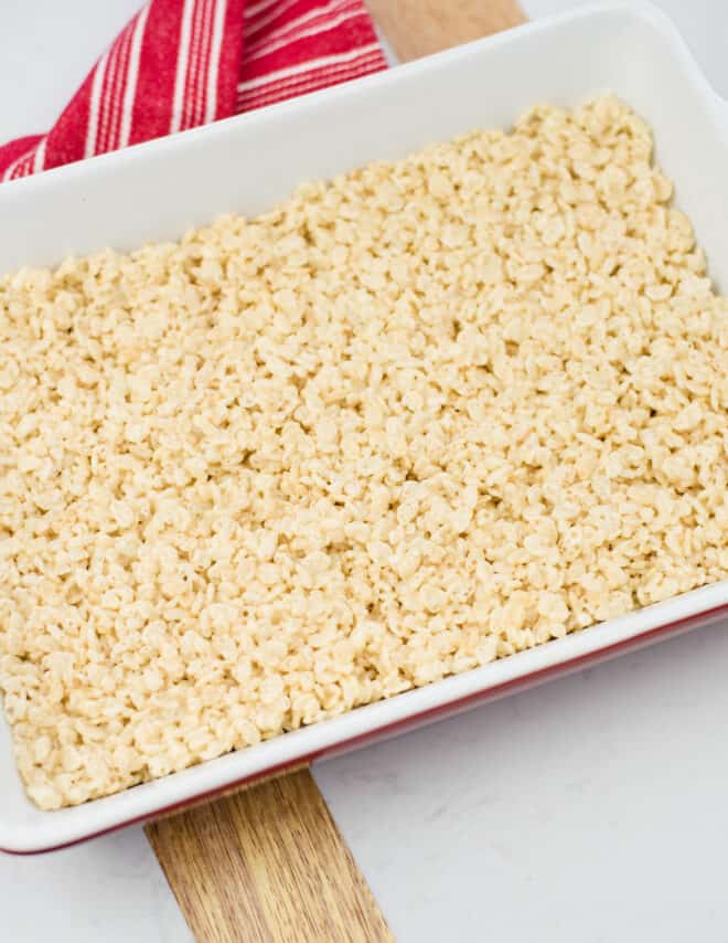 rice krispie bar mixture pressed into a 9x13 glass baking dish