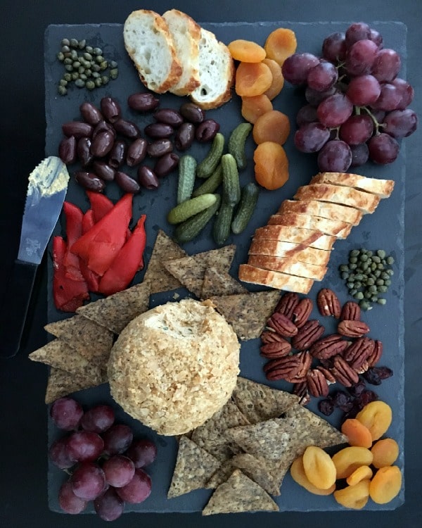 best cheese ball recipes featuring a pumpkin cheese ball on a charcuterie tray