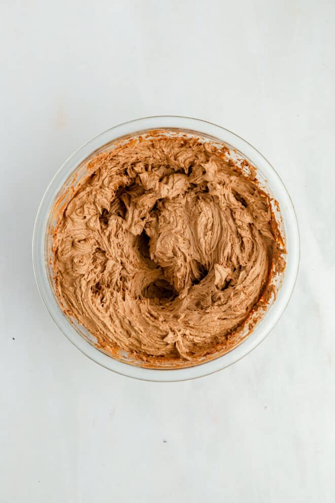 bowl of chocolate peanut butter frosting for cupcakes