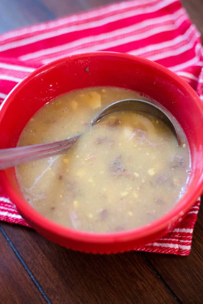 red bowl full of broth-based giblet gravy