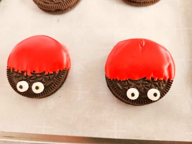 adding googly eyes to Oreos