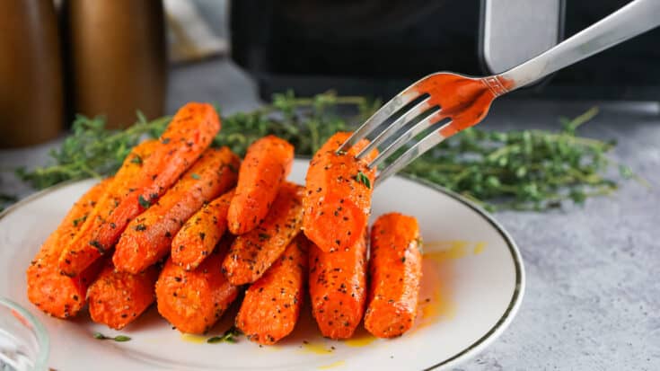 Tender Air Fryer Carrots on a white serving platter