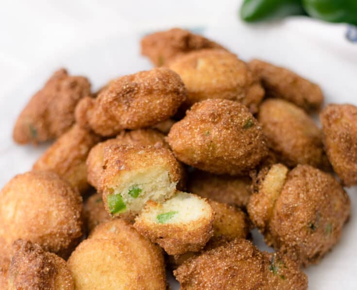 Jalapeno Hush Puppies on a paper-lined serving plate