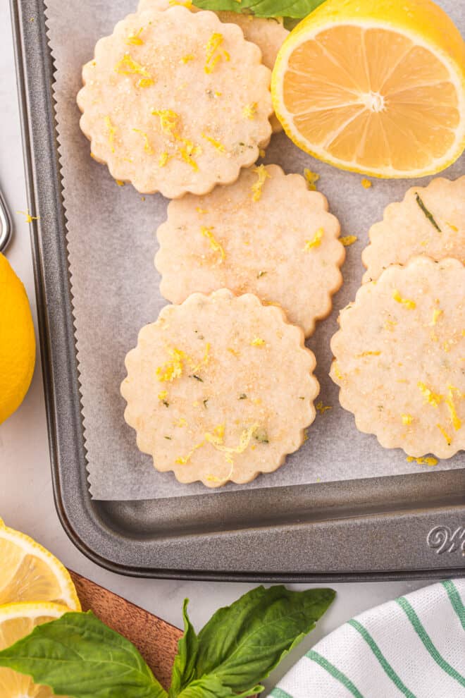 lemon basil shortbread cookies on cookie sheet, ready to eat