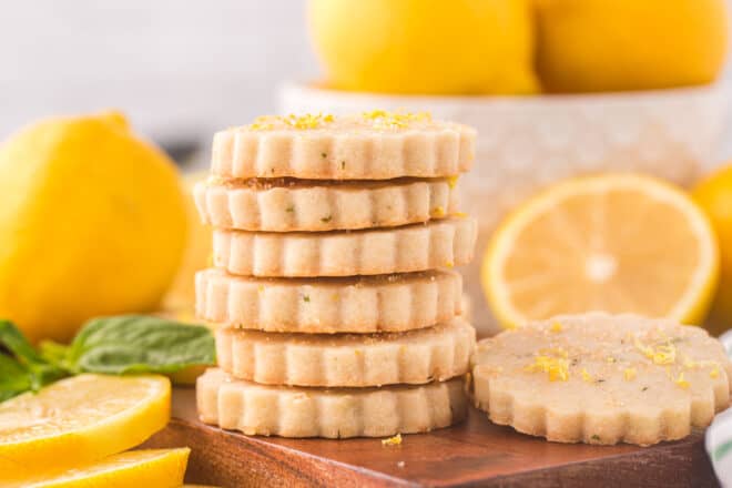 lemon basil shortbread cookies stacked on a serving tray