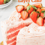 4 layer Strawberry Cake garnished with fresh strawberries