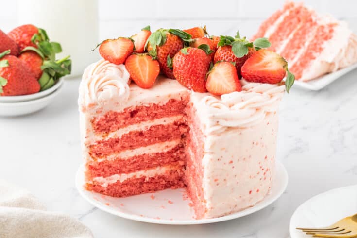 Double Strawberry Layer Cake topped with fresh strawberries