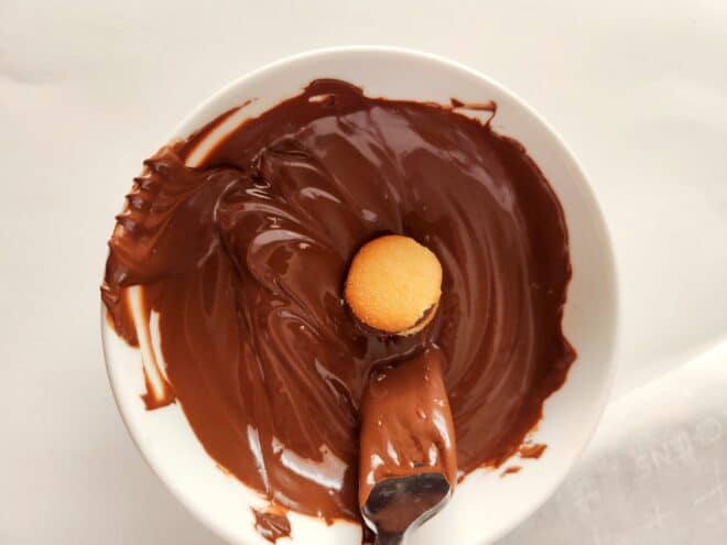 dipping candies in melted milk chocolate