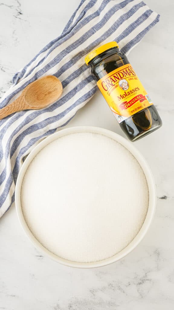 Ingredients to make homemade brown sugar - molasses and white granulated sugar in bowl