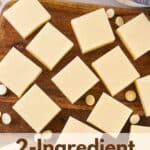 brown cutting board with a single layer of squares of vanilla fudge