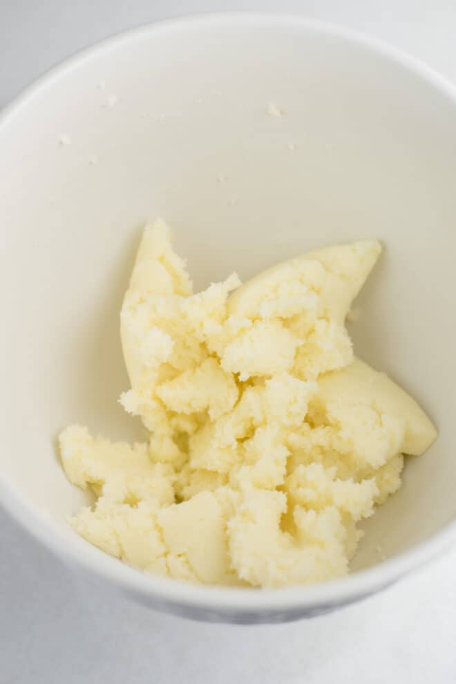 Butter and sugar creamed together in a mixing bowl