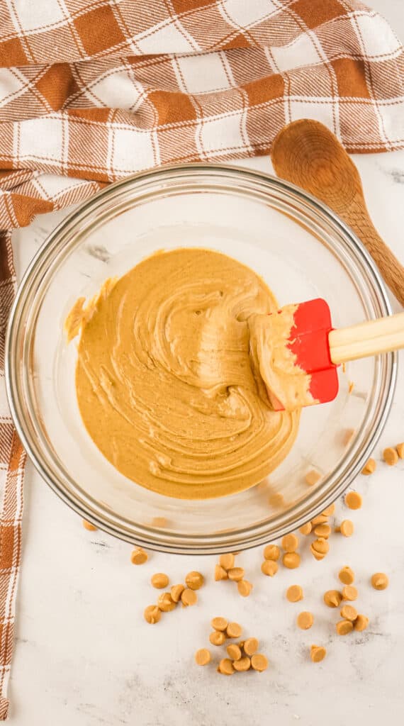 melted peanut butter chips in a glass mixing bowl