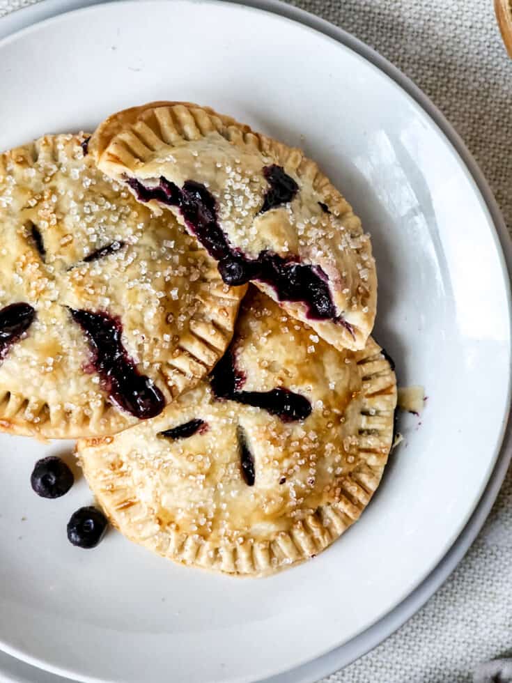 Blueberry Hand Pies on a white serving plate