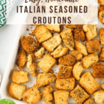 Italian Seasoned Croutons on A white baking sheet with text overlay