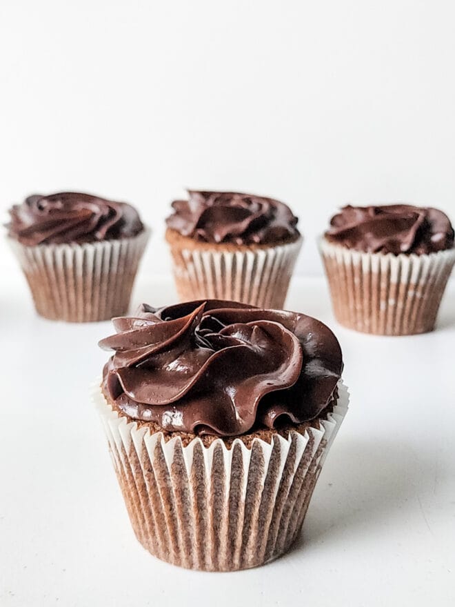 chocolate cupcakes topped with chocolate ganache