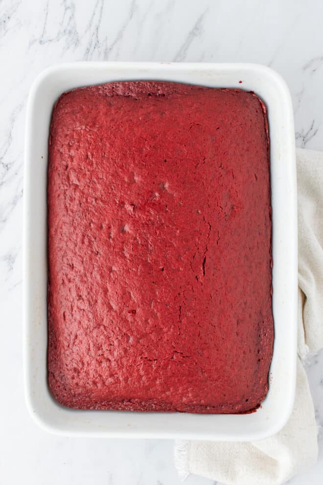 baked red velvet cake in a 9x13 inch baking pan