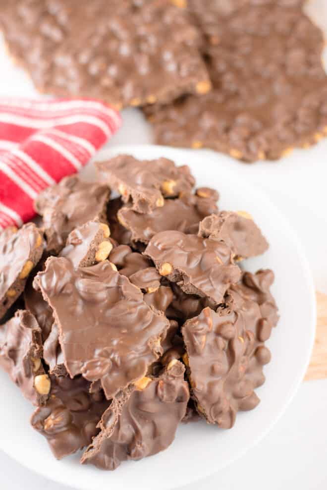 Pieces of Chocolate Peanut Butter Bark stacked on a serving plate