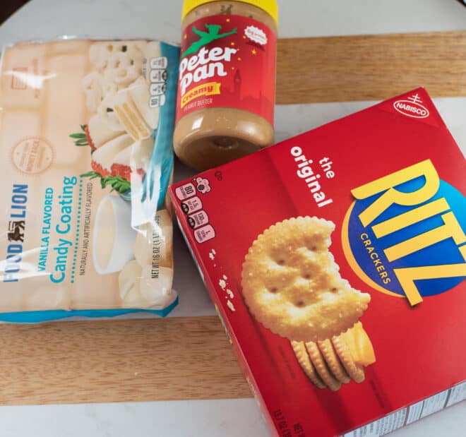 3 simple ingredients needed to make White Chocolate Ritz Crackers - white almond bark, Ritz crackers and peanut butter pictured.