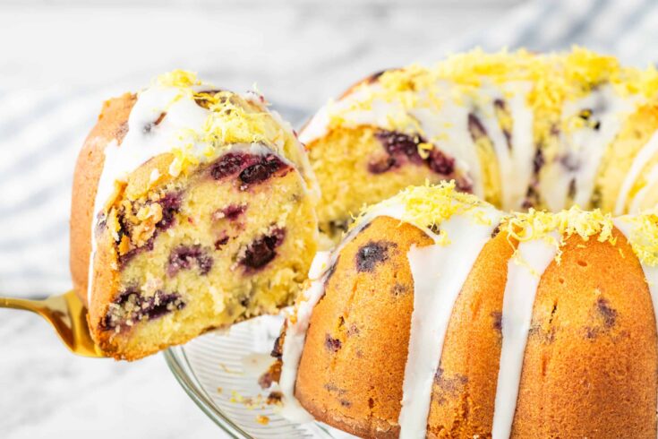 close up photo of lemon blueberry bundt cake with lemon glaze