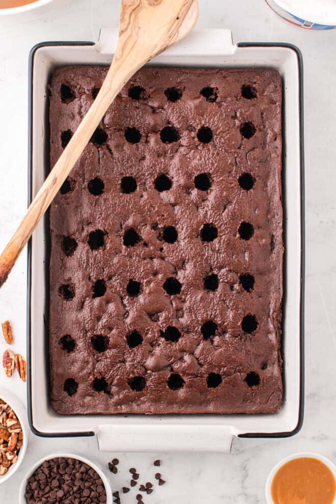 Poke holes in the chocolate cake