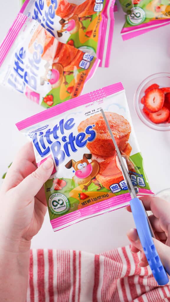 cutting side off of little bites mini muffins to make walking strawberry shortcakes