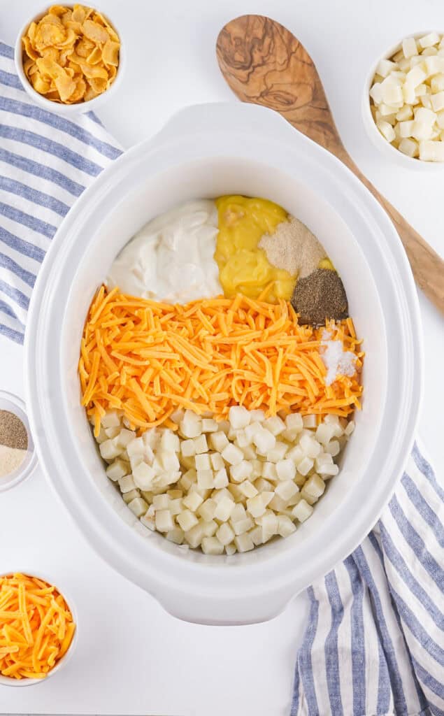 Step 1 - all ingredients added to slow cooker except for butter and cornflakes