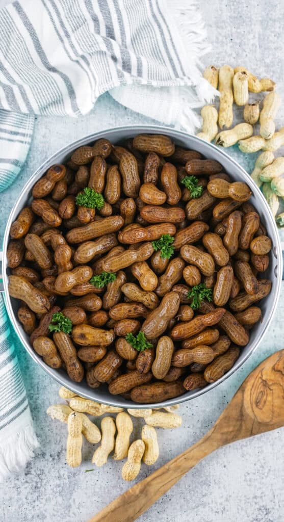 A big pot of boiled peanuts with parsley for garnish