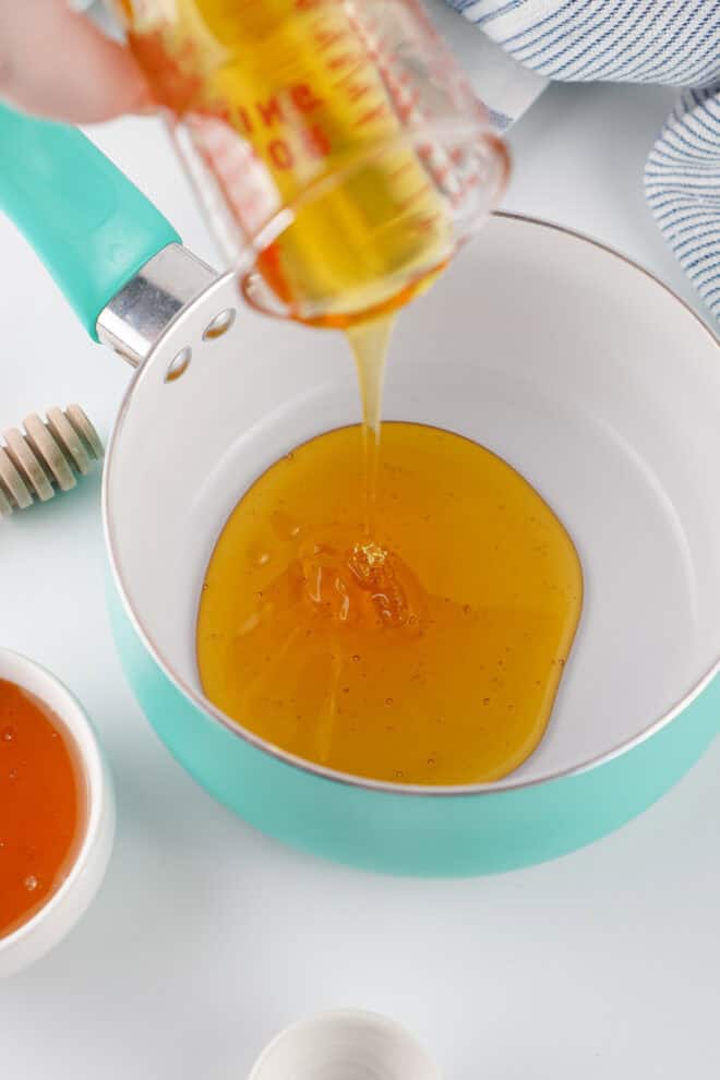 Honey being poured into a small simmer pot
