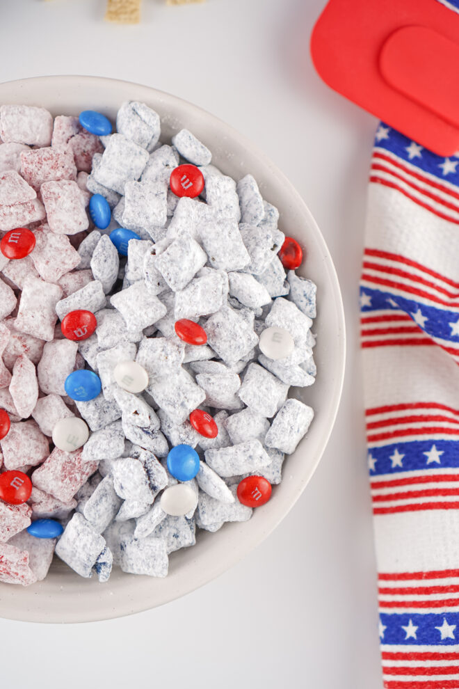 Patriotic Muddy Buddies in a white bowl for serving