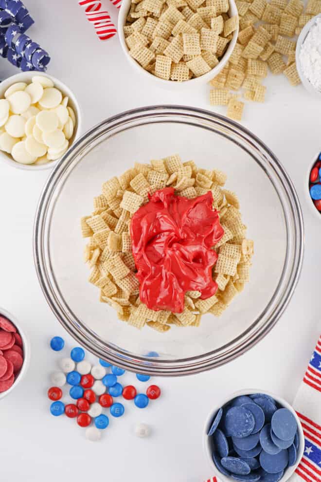 Melted red candy melts poured over Chex cereal