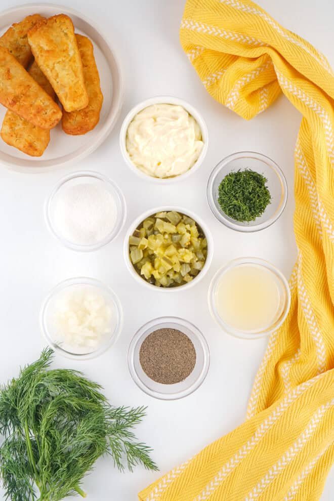 photo of ingredients used to make homemade tartar sauce including real mayo, pickles, dill weed, lemon juice and black pepper