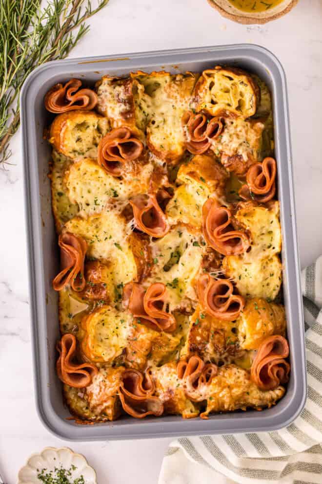 overshot of a 9x13 pan of ham and cheese croissant breakfast casserole